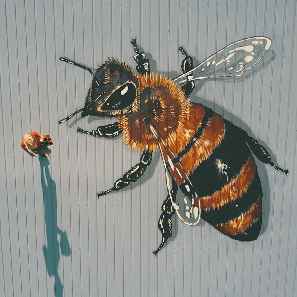 bee mural on a barn rooftop