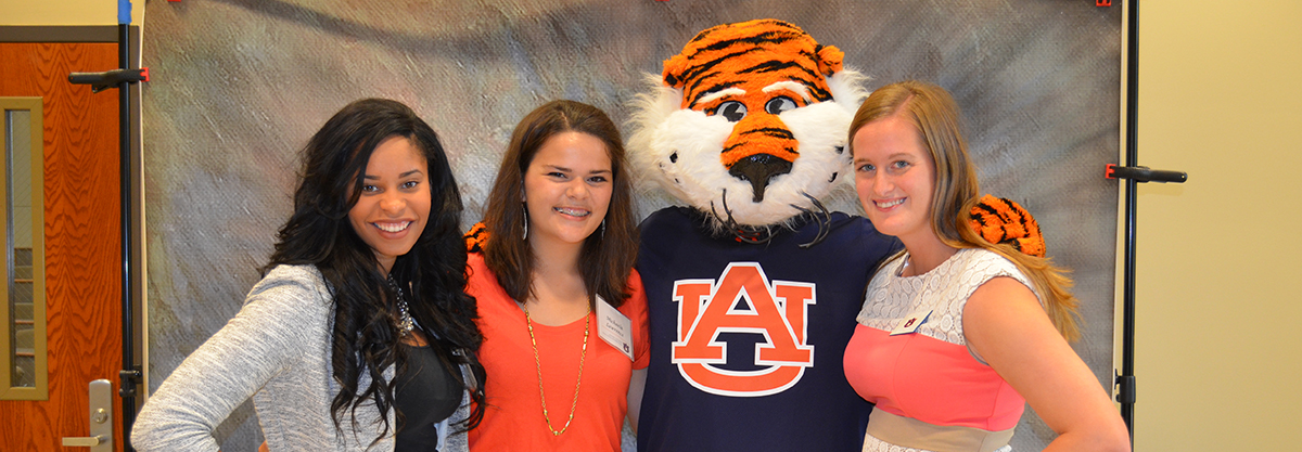 sfws interns pose with aubie at an event