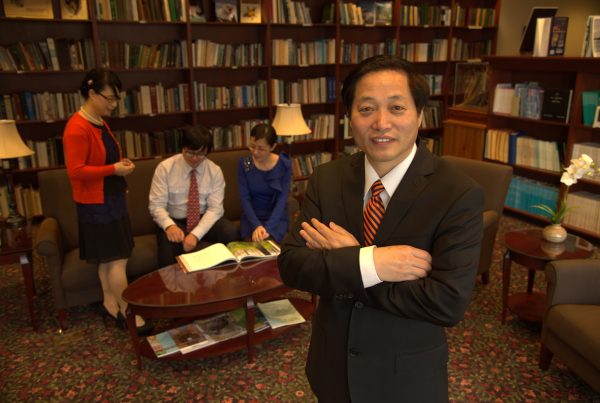 hanqin tian shown with faculty and graduate students at sfws library