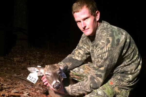 seth rankins pictured performing white tailed deer research