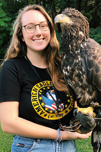 Andrea with a juvenile Bald Eagle
