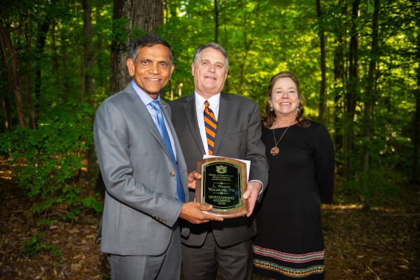 Dean Janaki Alavalapati is shown with the 2018 Outstanding Alumnus Award recipient, L. Frank Walburn '79 and his wife, Jacqueline.