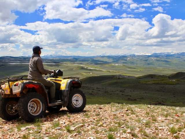 Olivia Wilkes riding an ATV to find Greater Sage-grouse in Utah