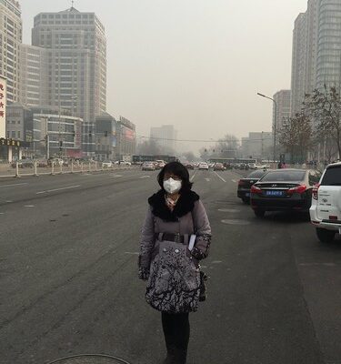 Assistant Professor Susan Pan wears a sanitary mask to protect herself from the smog.
