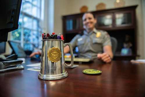The almuni keeps Auburn close by with an alma mater seal on a mug.