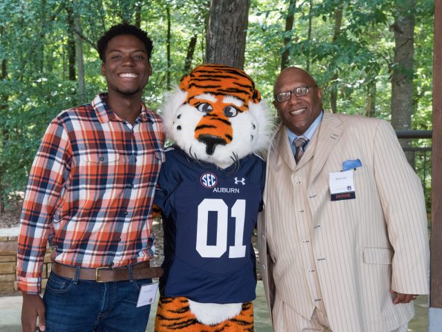 Snow with Dana Little and Aubie the Tiger at a scholarship event.