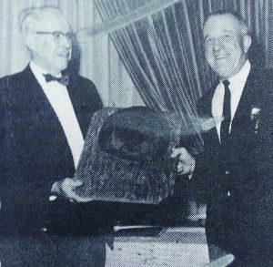 man presented award