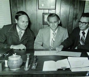 Foundation officers Harold Coan, Roy Gamble and Frank Stewart reviewing the foundation budget in 1976