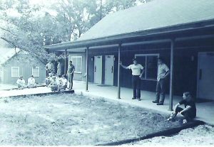 Students standing in front of new dormitories, Dixon Center, 1980