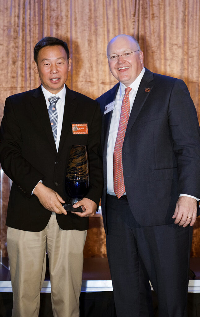 daowei zhang and Auburn University President Chris Roberts
