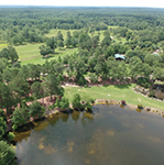 Aerial photo of Crooked Oaks farm and pond