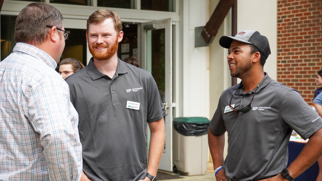 Russell Turner and International Paper colleague speaking with Extension Specialist & Harry E. Murphy Associate Professor, Forest Systems Management Adam Maggard at CFWE’s Fall 2023 Welcome Back Picnic.