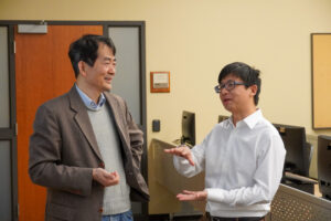 Li An and Zutao Yang discussing geospatial topics.