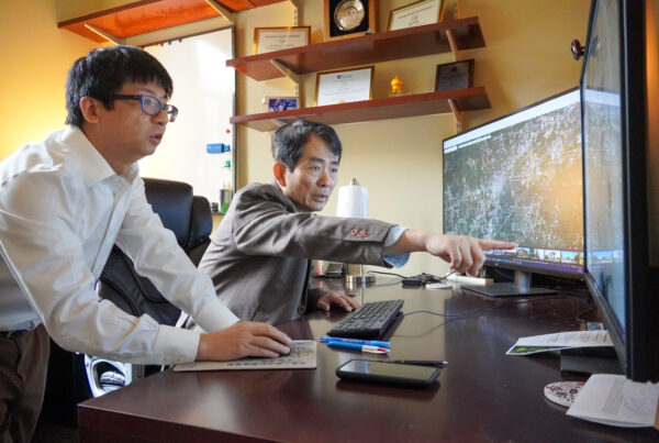 Zutao Yang and Li An survey satellite. imagery maps together