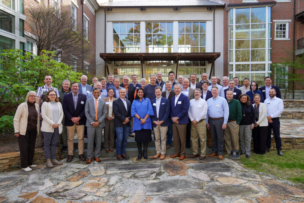 The 2024 CFWE Advisory Council poses for a group photo outside of the College of Forestry, Wildlife and Environment Building.
