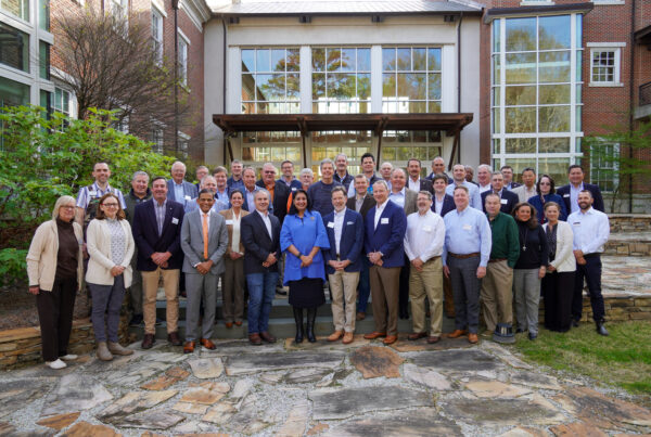 The 2024 CFWE Advisory Council poses for a group photo outside of the College of Forestry, Wildlife and Environment Building.