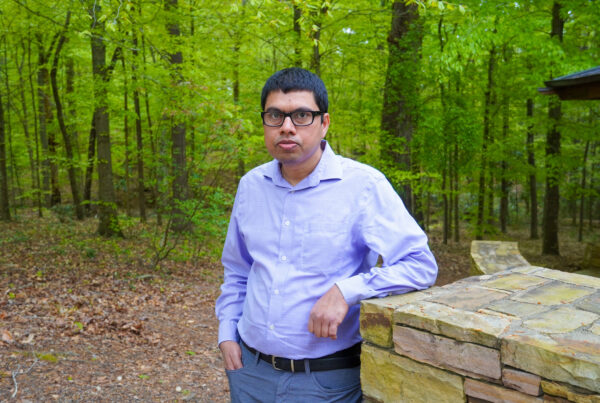 Sanjiv Kumar stands in the courtyard of the College of Forestry, Wildlife and Environment Building
