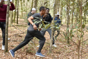 Abubakar Tahiru races to accomplish his world record tree hugging goal.