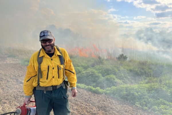 John McGuire helps with conducting a prescribed burn.