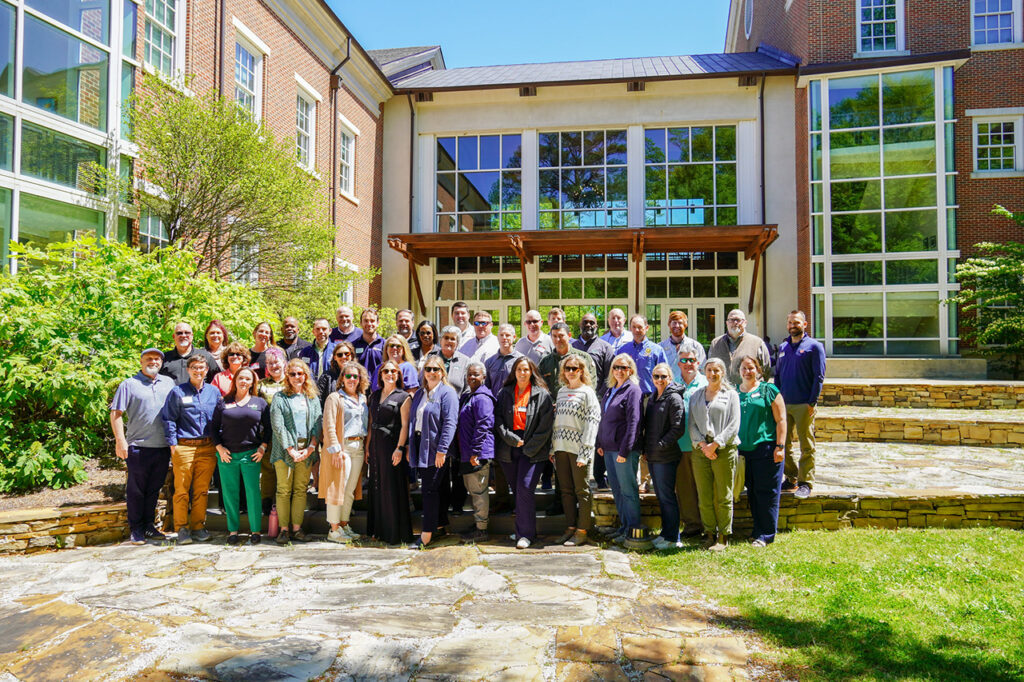 The PARK Summit poses for a photo in the College of Forestry, Wildlife and Environment's courtyard.