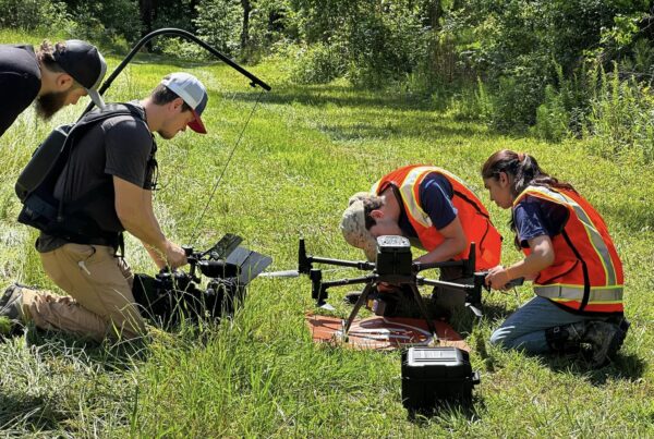 camera crew shoots footage of researchers using drone