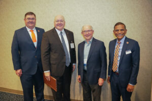 Adam Maggard, Christopher Roberts, Jeff Sessions, and Janaki Alavalapati pose for a photo at the CLT conference.