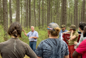 Matt Ezekiel shares his experience in a pine forest with students from the Yale University School of the Environment.