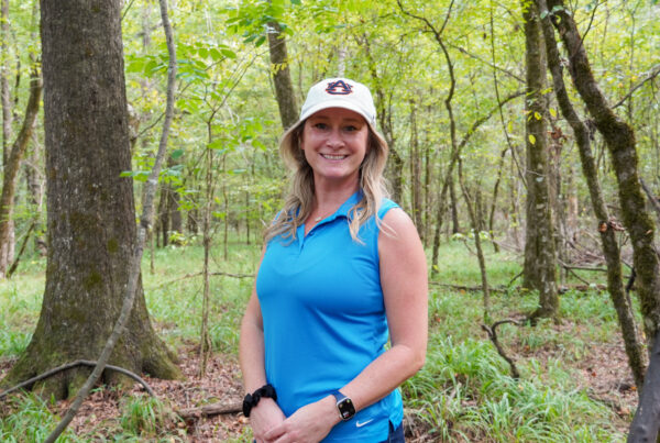 Kathleen Gabler standing in forest.