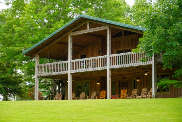 Two story cabin in greenery