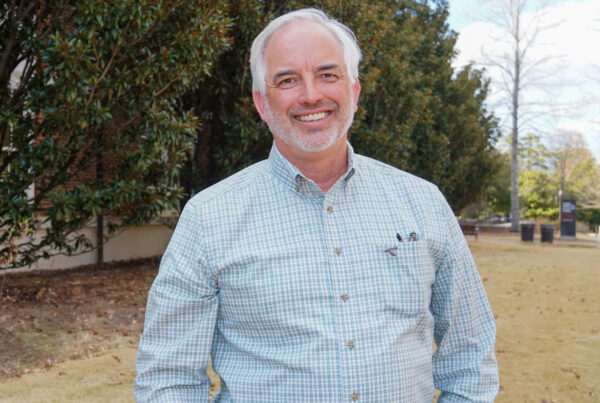 Jim Noles standing in front of the Auburn College of Forestry, Wildlife and Environment building.