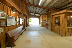 The breezeway at Crooked Oaks lodge featuring the Buddy and Paddy Moore Suite entrance and Auburn memorabilia placed by Coach Pat Dye.