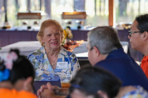 Woman sitting at table smiling