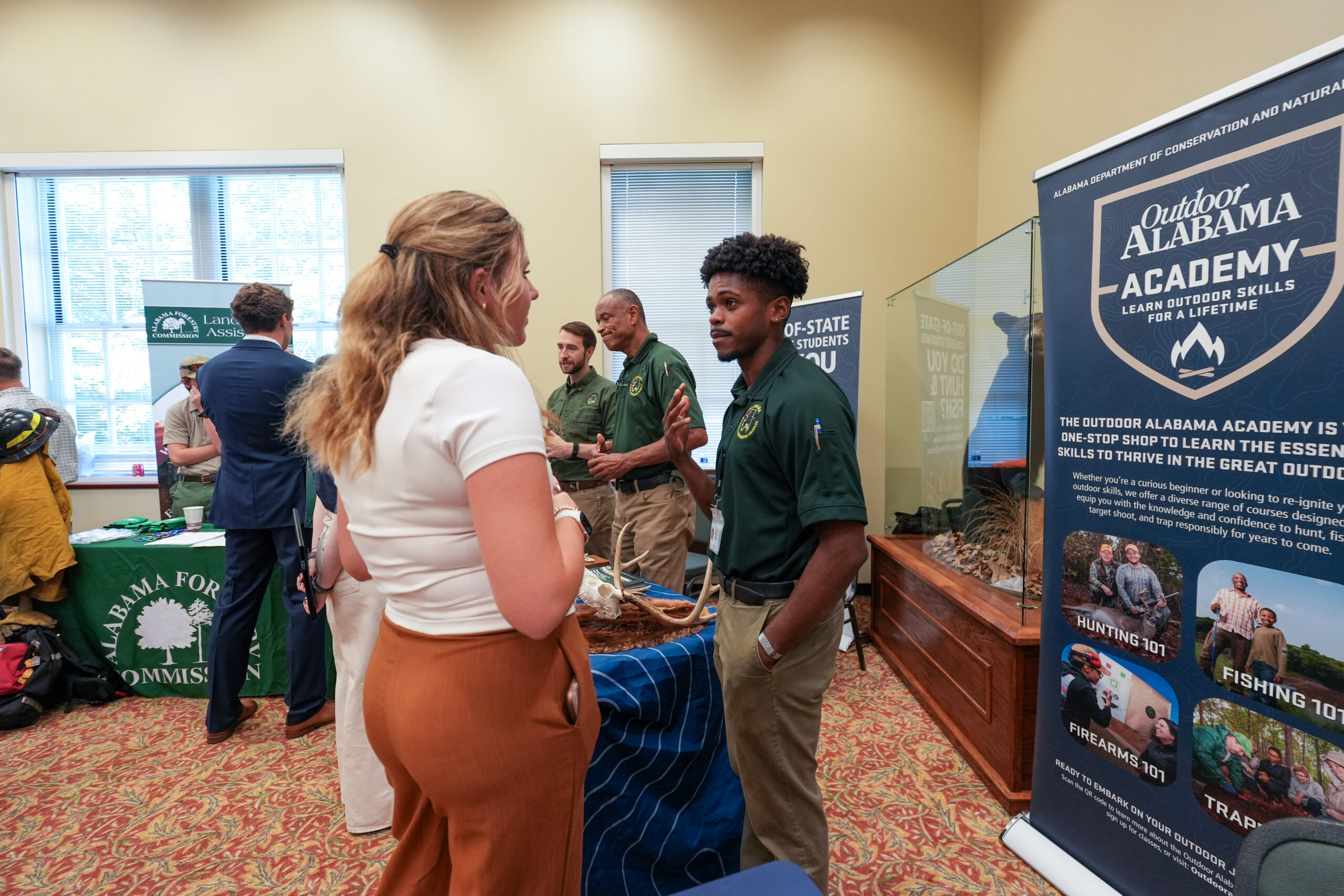 female students speaks with male employer at career fair