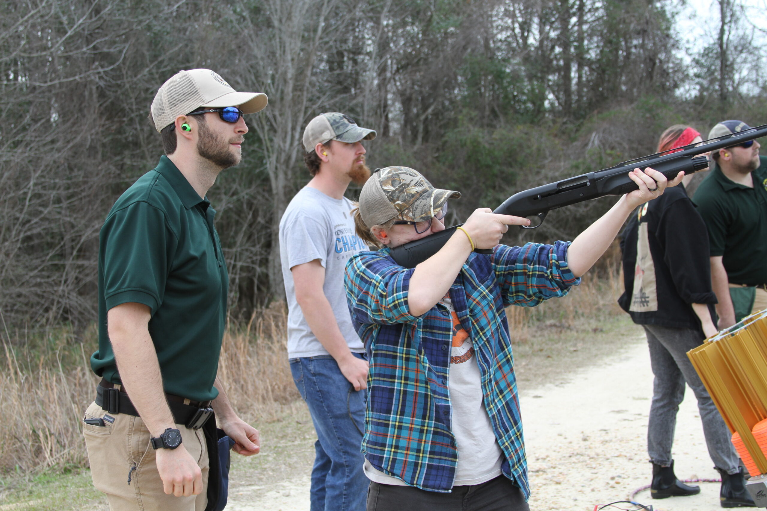 female student receives gun safety and operation training